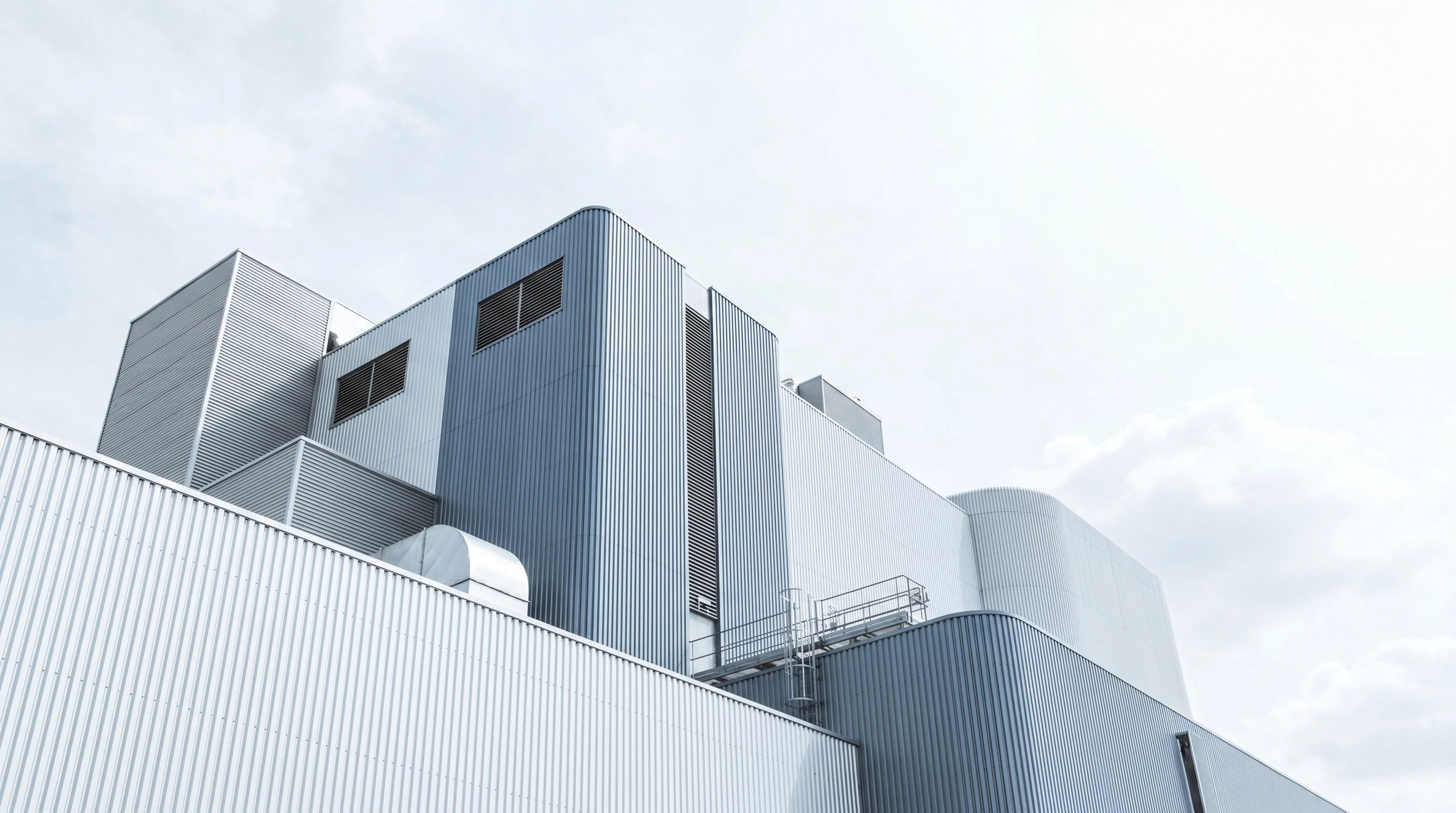 Industrial facility exterior with metallic cladding